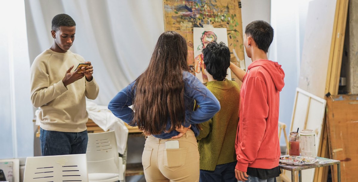 big-picture-w a group of people looking at a phone