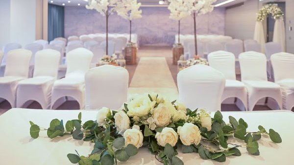 Wedding ceremony setup with white chairs and floral decorations at Sheraton Athlone Hotel